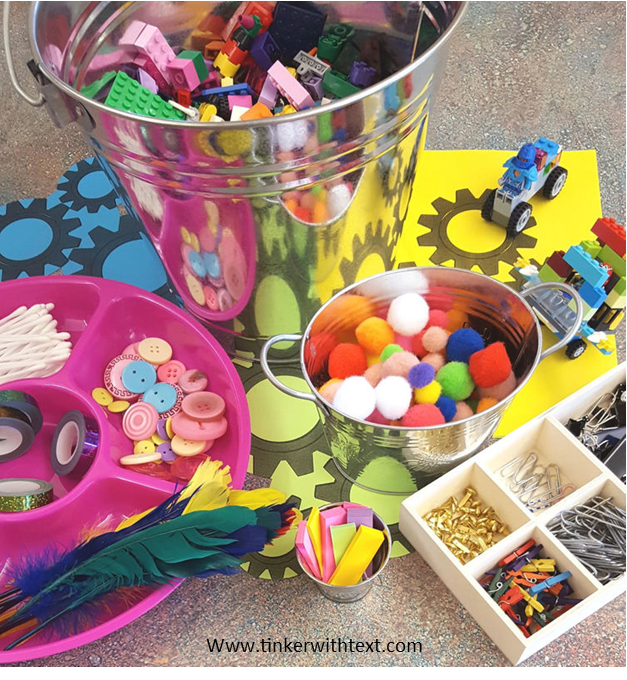 Tinkering supplies include pom poms, two color counters, gears and magnets.